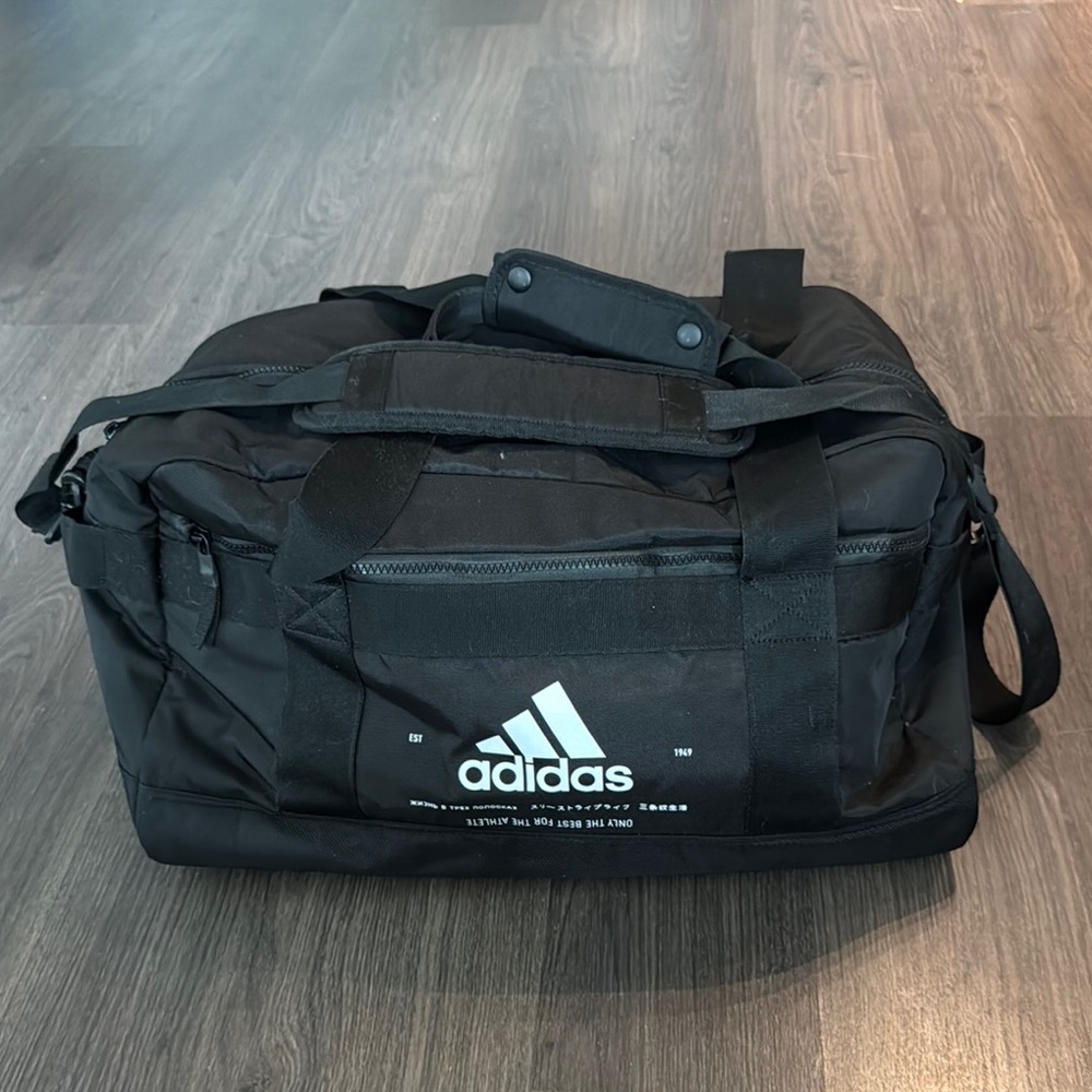 Adidas Black Duffel Bag with Adjustable Strap and Durable Design